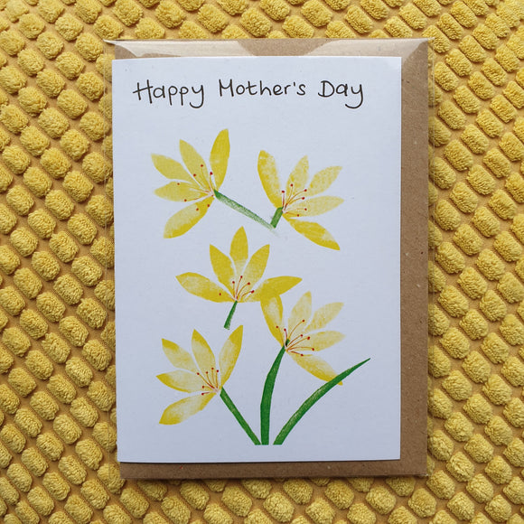 Yellow flowers card - reads 'Happy Mother's Day' at the top. The stylised Spring flowers are created with handmade stamps by Dot Cotton Crafts.