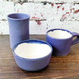 Handmade pottery dip bowl in purple and white