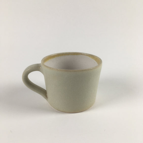 Handmade pottery mug in buttermilk matte glaze