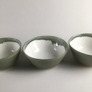 Handmade pottery breakfast bowl in sage green and white