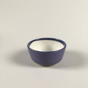 Handmade pottery dip bowl in purple and white