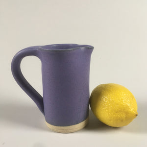 Handmade pottery cream jug in purple matte glaze